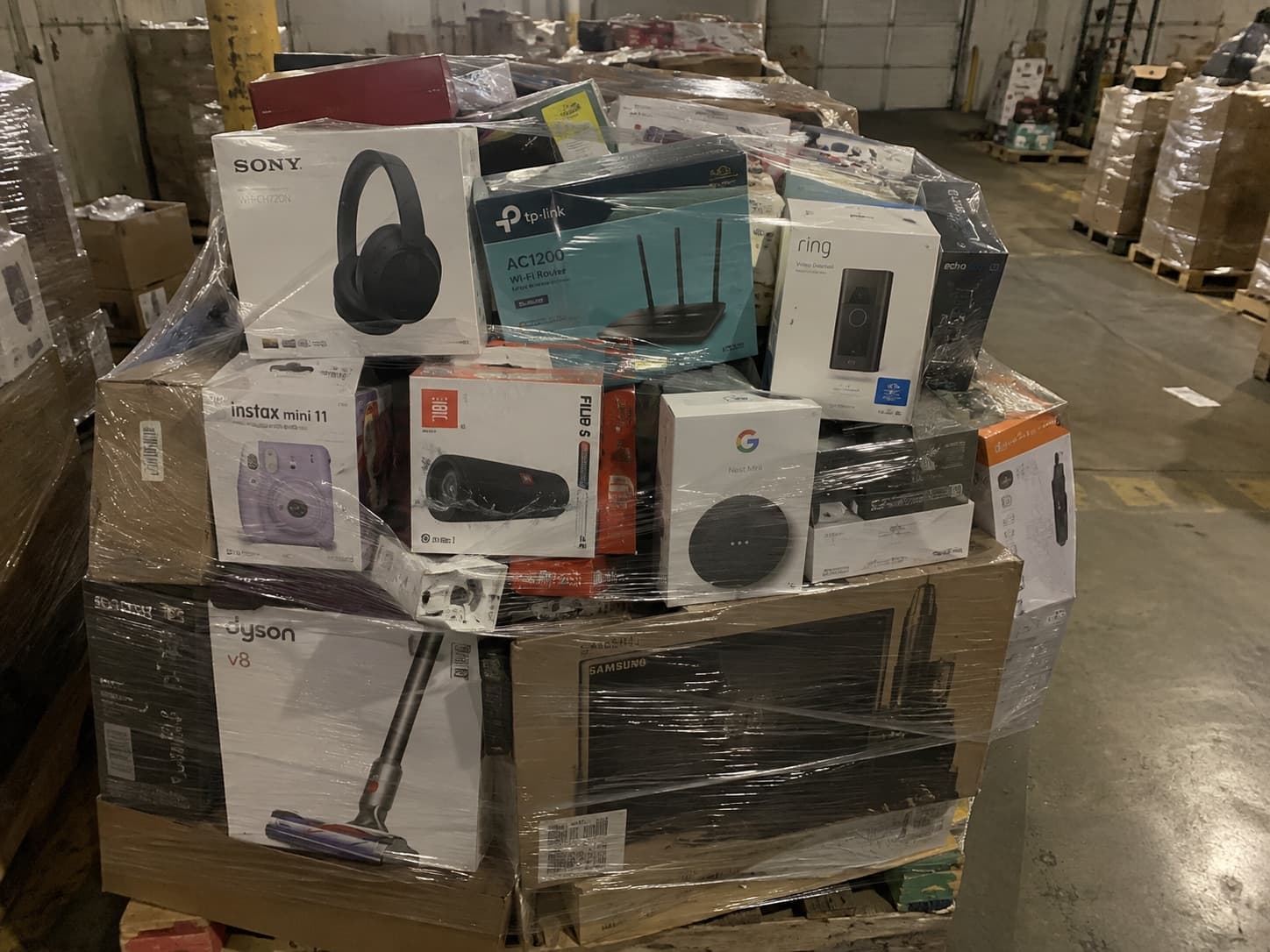 Pallet stacked with boxed consumer electronics inventory